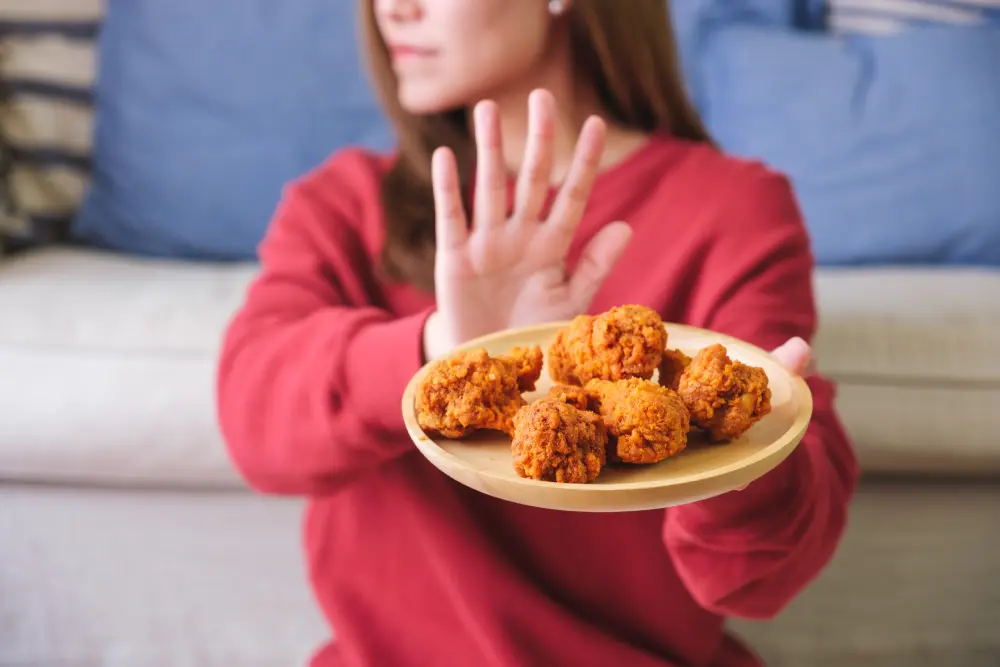 Woman refusing fried chicken