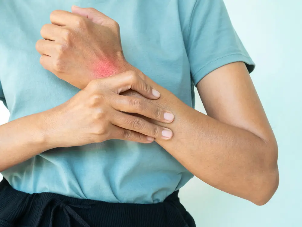 A woman suffering from severe wrist pain